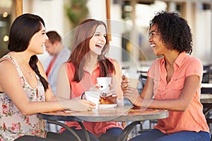 Three Female Friends Meeting In CafÅ½