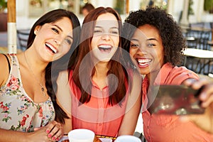 Three Female Friends Taking Selfie In CafÃÂ½