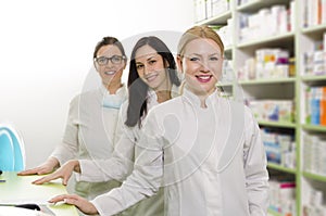 Three female pharmacists on work