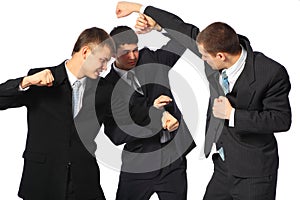 Three fighting businessmen