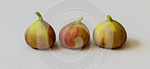 Three figs on white background