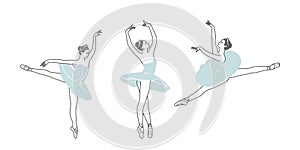 Three figures of dancing ballerinas. photo