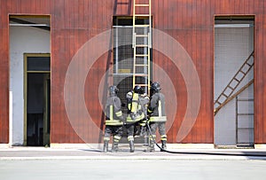 three firefighters in the fire brigade