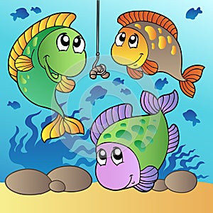 Three fishes and fishing hook photo