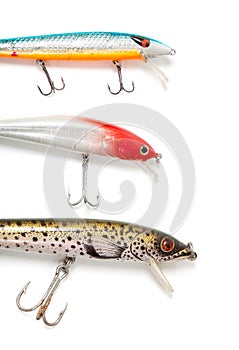 Three fishing lures on white background
