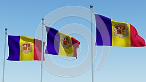 Three flags of Andorra waving in the wind against blue sky.