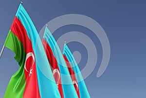 Three flags of Azerbaijan on flagpole on blue background. Place for text. The flag is unfurling in wind. Azerbaijani. Asia, Baku.