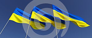 Three flags of Ukraine on flagpole. Blue and yellow Ukrainian flag with coat of arms. State symbols of Ukraine. Trident. The flag