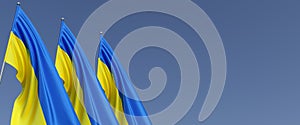 Three flags of Ukraine on flagpoles on blue background. Blue and yellow flag. Place for text. State Ukrainian symbol. Independent