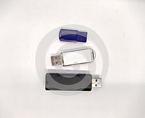 three flash drives. three USB flash drives on a white background top view