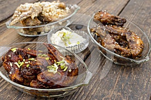 Three flavors of Chicken Wings - Honey Soy, Buffalo, and Garlic Parmesan Wings, with ranch dip at the center