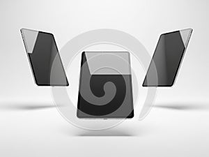 Three floating tablets in black and gray
