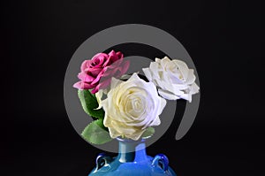 Three Flowers in a Blue Vase