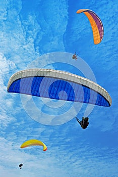 Three flying parachutes