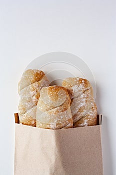 Three fresh baguettes in paper bag