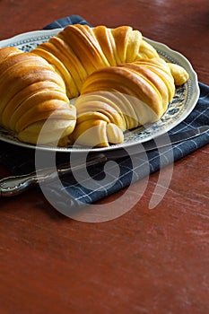 Brioche Croissants, Leavened Portuguese Pastries on Kitchen Table photo