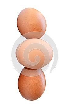 Three fresh brown chicken eggs in stack isolated on white background with clipping path