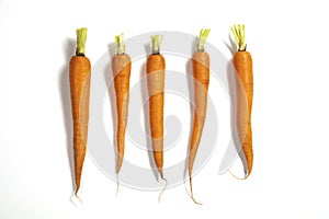 Three fresh carrots on a white background