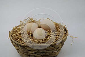 Three Fresh Eggs in bamboo basket