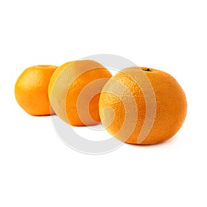 Three fresh juicy grapefruits composition isolated over the white background