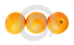 Three fresh juicy grapefruits composition isolated over the white background