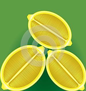 Three fresh lemon in a longitudinal section on a green background