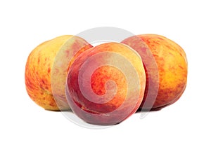 Three fresh peaches