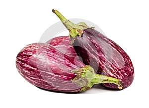 Three purple eggplants