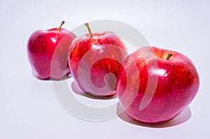 Three fresh red apple