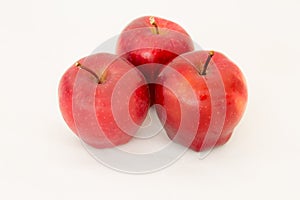 Three Fresh red apple on white.