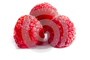 Three fresh red sweet raspberry