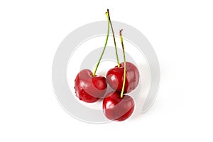 Three fresh ripe cherries