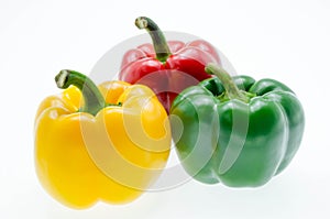 Three fresh sweet pepper isolated on white background