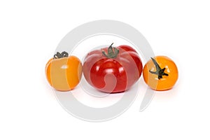 Three fresh tomatoes isolated on white background
