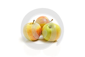 Three fresh yellow green apples isolated on the white background