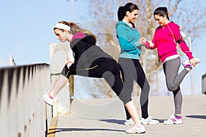 Three friends doing push-ups