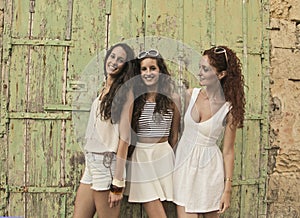 Three friends dressed in white