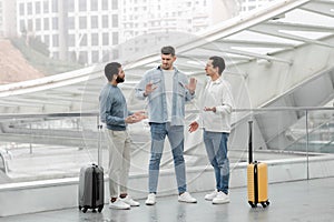 Three Friends Guys Having Quarrel During Vacation Travel In Airport