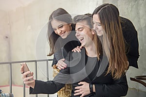 Three friends having fun in a cafe