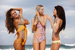 Three Friends in Swimsuits at the Beach