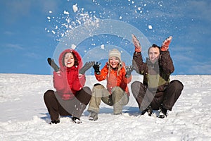 Three friends throw snows