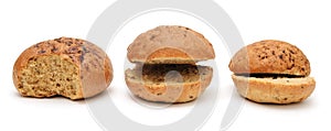 Three funny cut flax burger buns for a hamburger isolated on a white background.