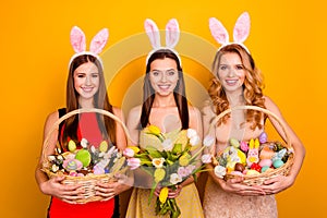 Three funny sisters ladies holding easter presents came family gathering traditional meeting wear fluffy ears isolated