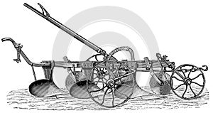 Three-furrow plow with wheel shear. photo