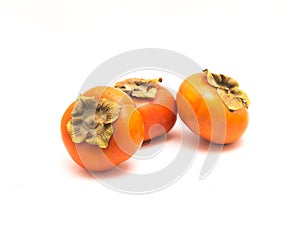 Three Fuyu persimmon isolated