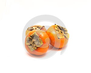 Three Fuyu persimmon isolated