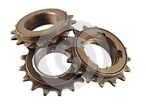 Three gear wheels and cogs.