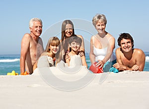 Three Generation Family Building Sandcastles