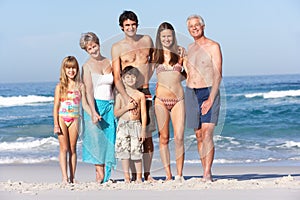 Three Generation Family On Holiday At The Beach