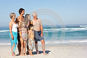 Three Generation Family On Holiday On The Beach